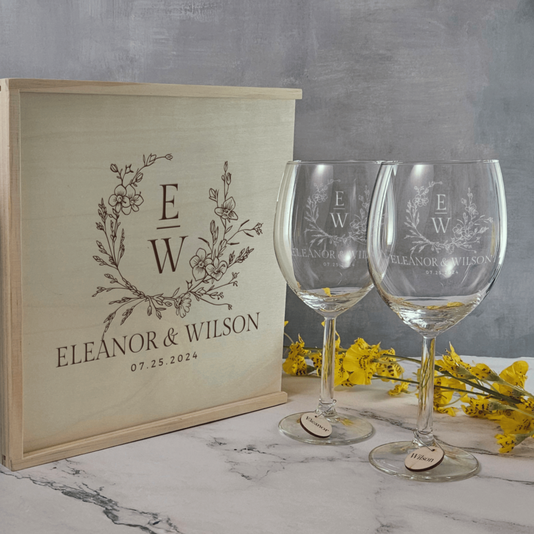 a bottle of wine sitting next to two wine glasses