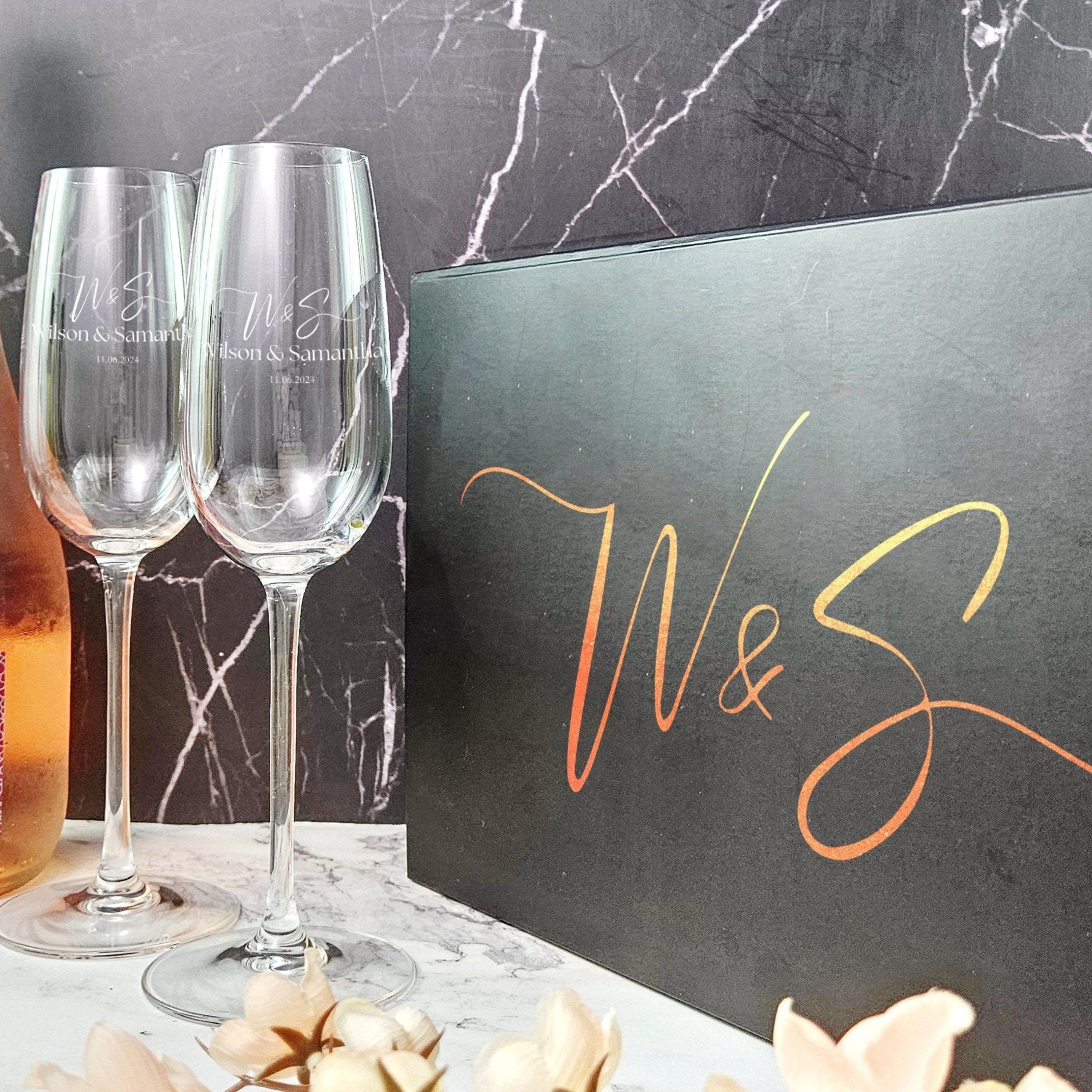 a couple of wine glasses in a gift box