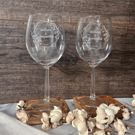 a couple of wine glasses sitting on top of a table