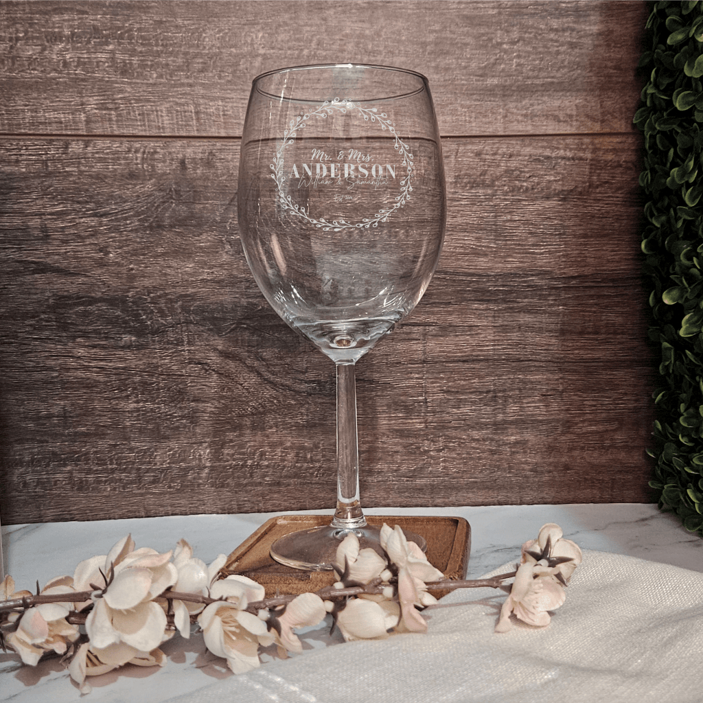 a wine glass sitting on top of a table