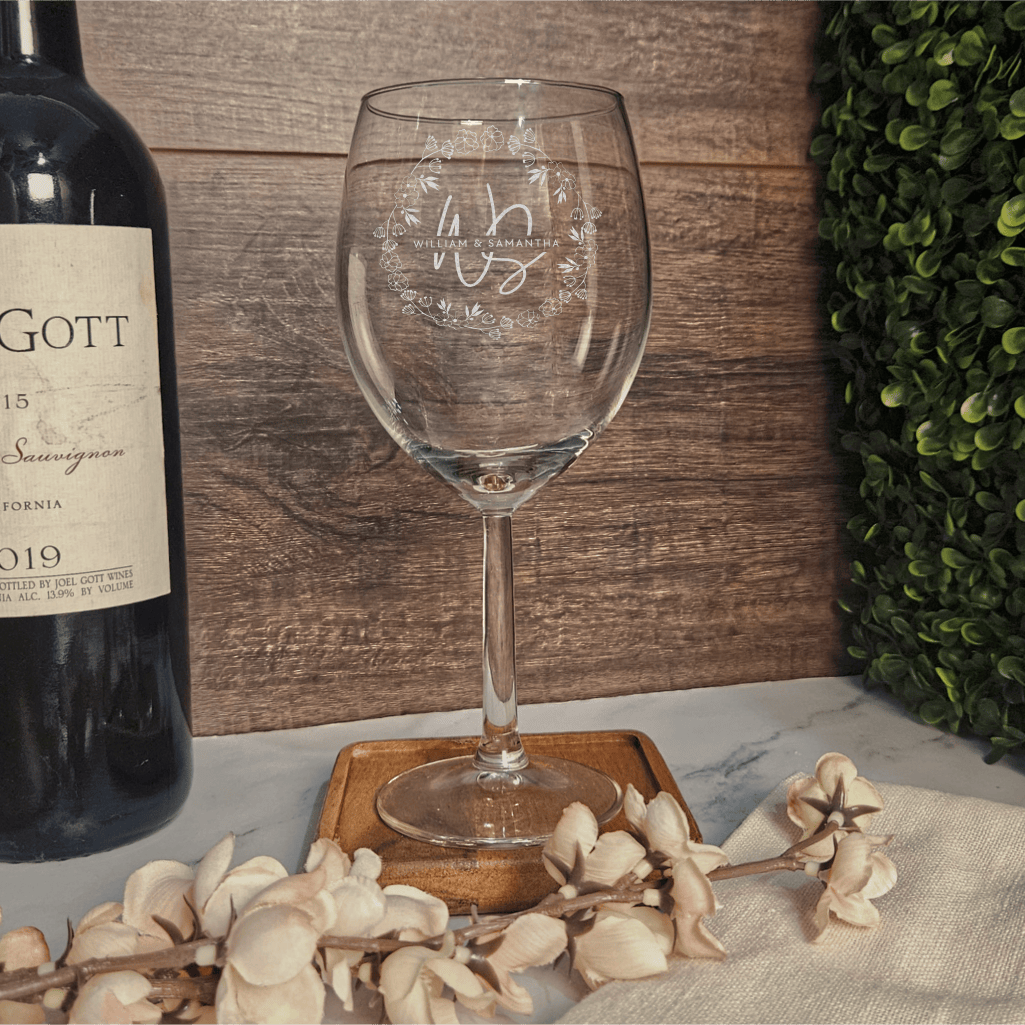 a bottle of wine sitting next to a wine glass