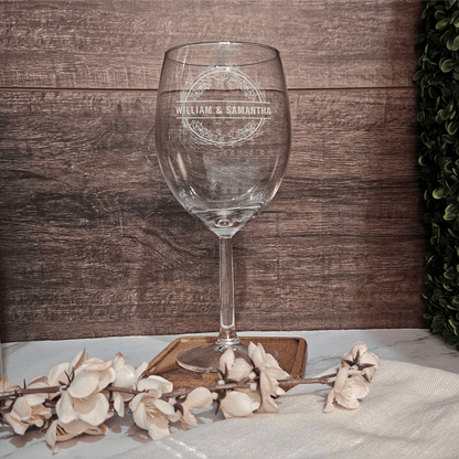 a wine glass sitting on top of a table