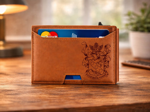 Brown leather wallet with card slots on a wooden surface