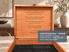 An open wooden keepsake box with a warm honey-brown interior, showing engraved text on the inside lid. A dark overlay in the lower right says 'Inside Lid Engraving – Optional' and 'Add a heartfelt message inside the lid to make your gift even more meaningful.