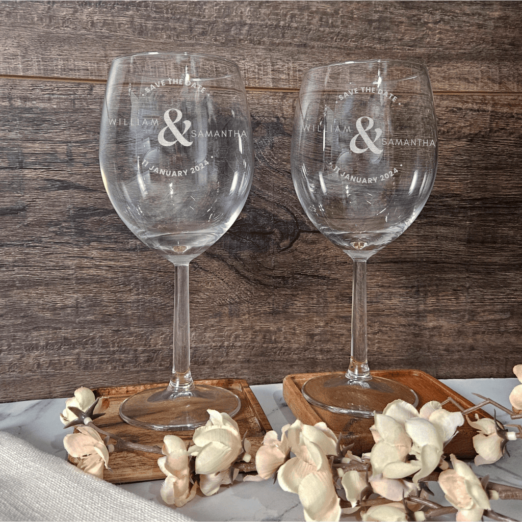 a couple of wine glasses sitting on top of a table