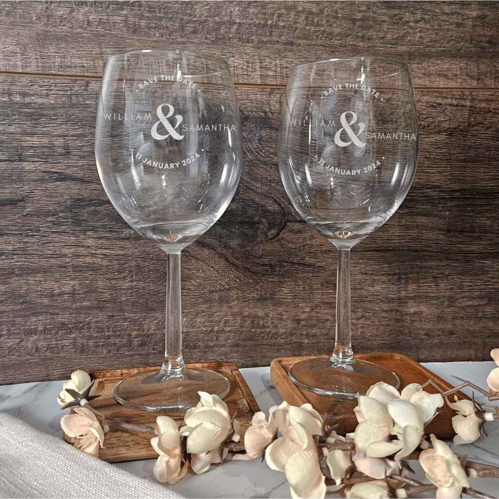 a couple of wine glasses sitting on top of a table