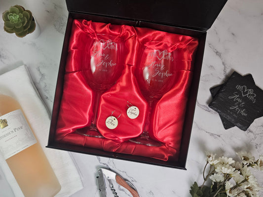 a couple of wine glasses in a box