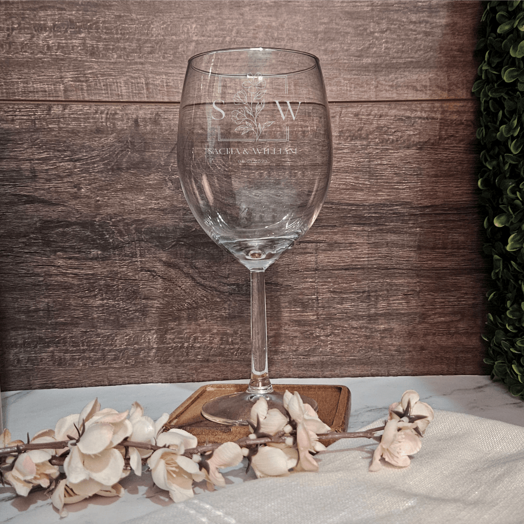 a wine glass sitting on top of a table
